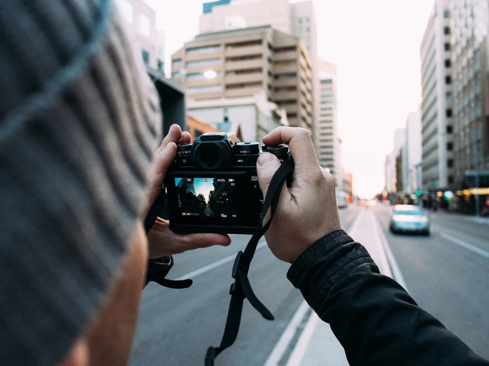 A photographer with a camera shooting inside a restaurant
