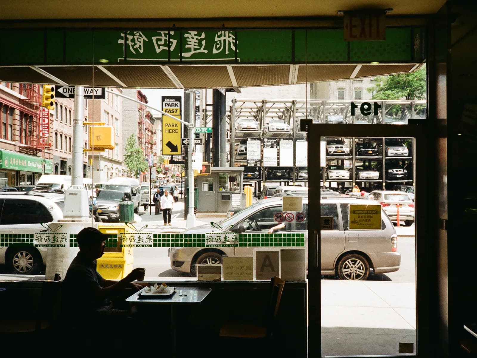 A restaurant window seat looking out onto a busy New York street